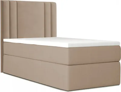 A studio shot of a bed with a headboard and mattress.