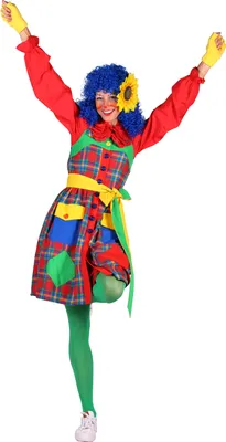 A woman dressed as a clown, posing with her arms raised.