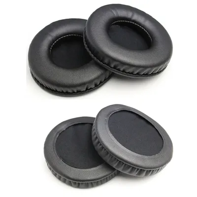 Two pairs of black headphone ear pads are displayed on a white background.