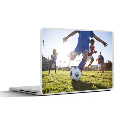 Produktbild von MuchoWow® Laptop Aufkleber Sticker Cover Junge spielt Fußball 25x18 cm - Laptop-Deko