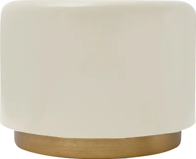A close-up studio shot of a small, cylindrical table with a cream-colored top and a gold-colored base.