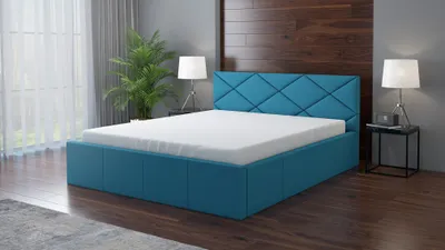 A modern blue upholstered bed with a white mattress in a bedroom setting.