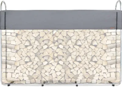A firewood rack filled with logs, covered by a gray tarp.