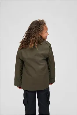A young girl is shown from the back, wearing a green jacket and black pants.
