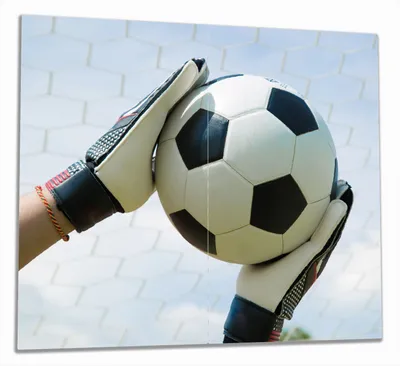 Produktbild von Wallario Herdabdeckplatte aus Glas, Größe 60 x 52 cm 2-teilig, Motiv Fußball - Torwart im Tor vor blauem Himmel