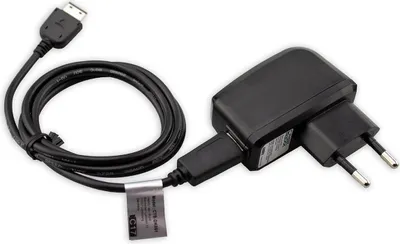 A black phone charger with a coiled cable and a European plug.