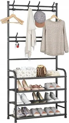 A freestanding coat rack with a shoe shelf.