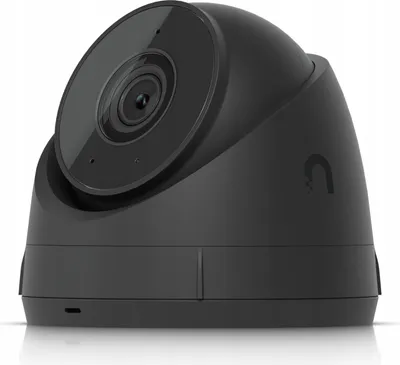 A black security camera is shown from a low angle against a white background.