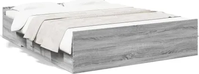 A bed frame with bedding.