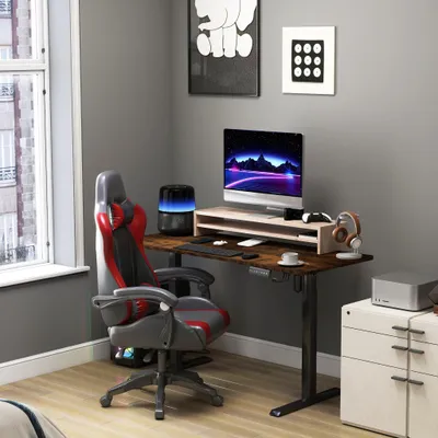A home office setup with a computer desk, chair, and accessories.