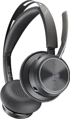 A close-up studio shot of a black and gray Poly Voyager Focus 2 UC headset.