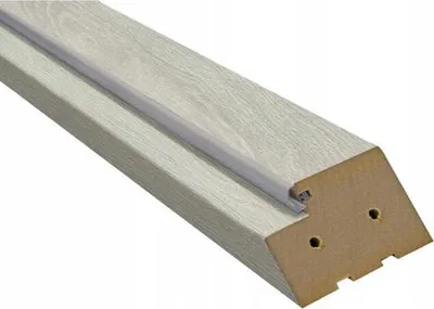 A close-up, angled view of a single piece of door frame trim.