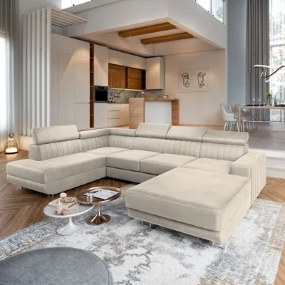 A modern living room with a large sectional sofa and a dining area visible in the background.