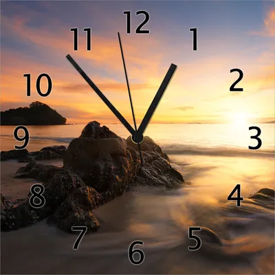 Produktbild von Wallario Design Wanduhr Sonne über dem Meer mit Felsenlandschaft aus Echtglas, Größe 30 x 30 cm