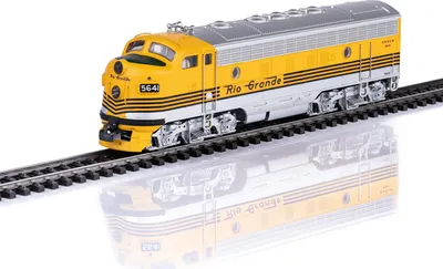 A model train on a track, with a reflection below.