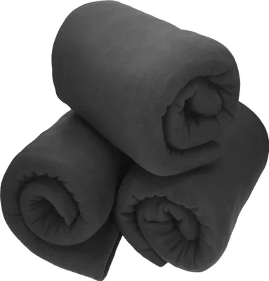 Three rolled-up dark gray fleece blankets are stacked on a white background.