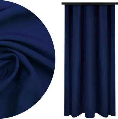A close-up of dark blue fabric and a dark blue curtain hanging.