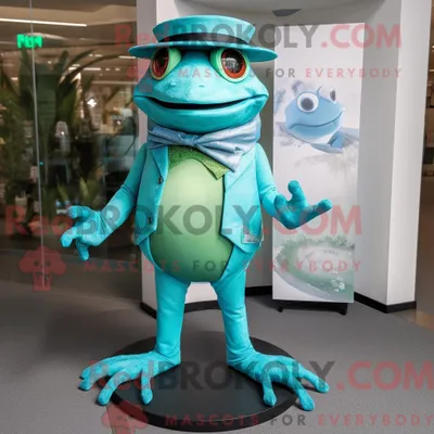 Obrázek produktu pro Postava REDBROKOLY maskota tyrkysové žáby oblečená do body a čepice