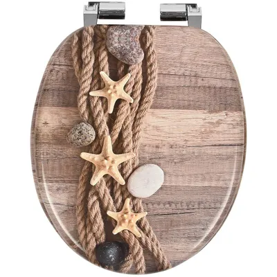 A toilet seat with a decorative print of a rope, starfish, and stones on a wooden background.