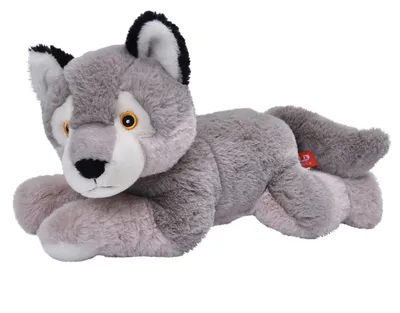 A plush wolf toy lying down on a white background.