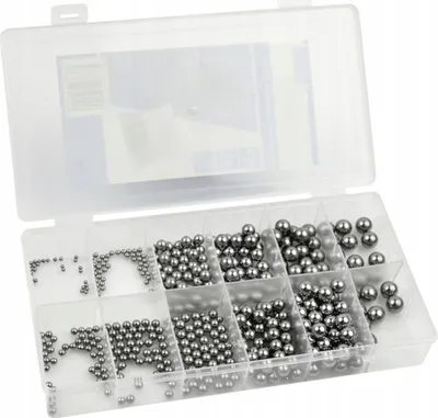 A clear plastic organizer box filled with various sizes of metal ball bearings.