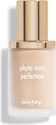 A close-up studio shot of a bottle of foundation with a gold cap.