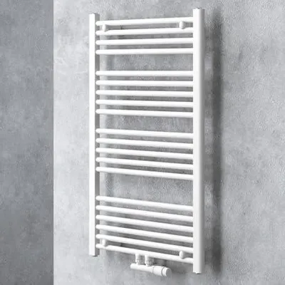 A white radiator is mounted on a textured gray wall.
