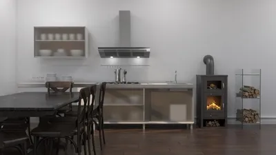 A modern kitchen with a dining table and chairs, a stove, and a wood-burning stove.