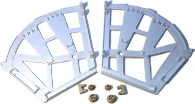 Two white plastic corner brackets and four small tan plastic connectors are arranged on a white background.