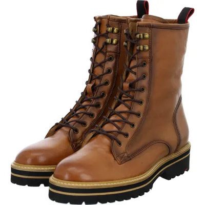 A pair of brown lace-up boots with thick soles.