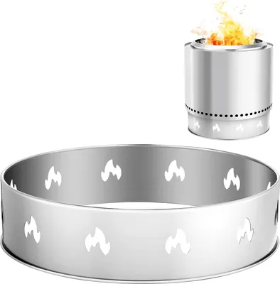 A silver metal ring with flame cutouts in the foreground, and a silver cylindrical fire pit with flames on top in the background.
