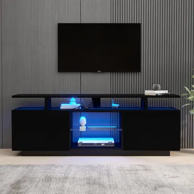 Image de Meuble TV bas de 140 cm, noir brillant, avec éclairage LED et panneaux en verre, dimensions : 140 x 35 x 55 cm