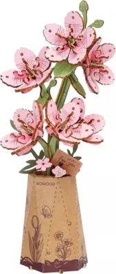 A 3D wooden puzzle of pink flowers in a vase.
