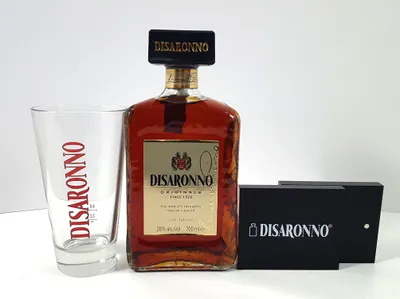 Produktbild von Disaronno Set - Disaronno Liqueur 0,7l 700ml (28% Vol) + Glas geeicht 2/4cl + 2x Tischaufsteller / Servietten halter