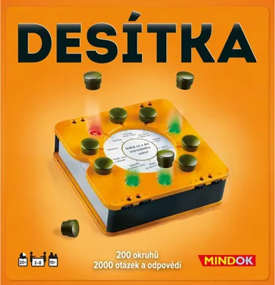 A board game called Desitka by Mindok is shown on an orange background. The game board is open, revealing a circular area with questions and several green and red lights. Small green tokens are scattered around the board and in the air above it.