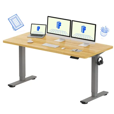 A height-adjustable desk with dual monitors, a laptop, and accessories.