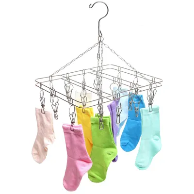A stainless steel sock drying rack with multiple clips, holding several colorful socks.