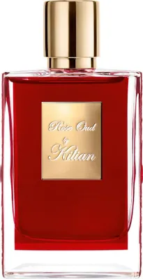 A close-up studio shot of a red perfume bottle with a gold cap and label.