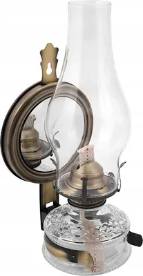 A wall-mounted oil lamp with a mirror.