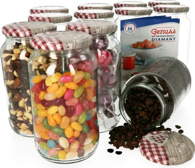 A collection of glass jars filled with various items like nuts, jelly beans, and coffee beans, with a decorative lid on one jar and a packet in the background.