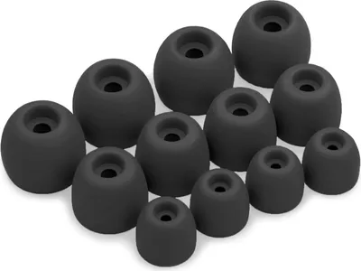 A collection of black silicone earbud tips arranged on a white background.