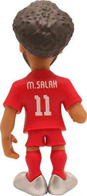 A figurine of a soccer player from behind.
