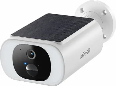 A white outdoor security camera with a solar panel on top, mounted on a white circular base.