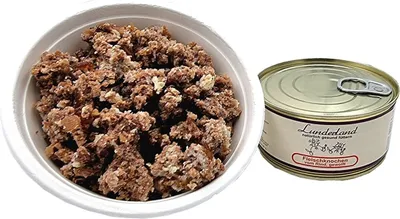 A can of dog food and a bowl of dog food.