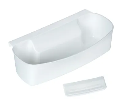 A white plastic kitchen waste bin attachment and a small separate piece.