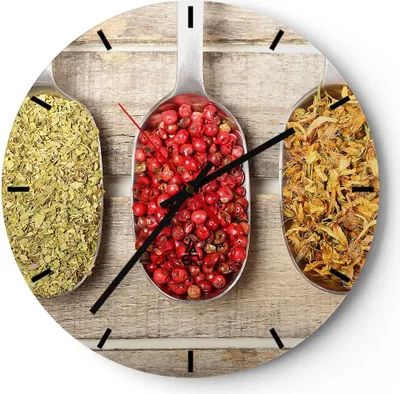 A round clock with a wooden background, featuring three spoons filled with spices as the clock face.