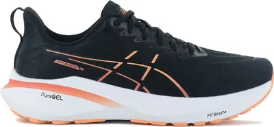 A side view of a single black running shoe with orange accents.