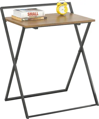 A small folding desk with a book and a clock on it.