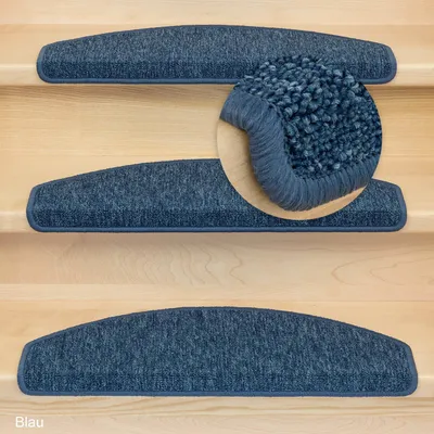 Close-up view of blue stair mats on wooden stairs, with a magnified section showing the texture of one mat.