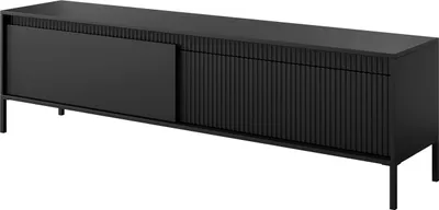 A black TV stand with a ribbed front and a sliding door.